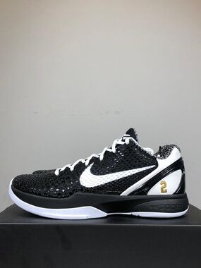 Nike Black and White Low-Top Athletic Sneakers with Gold Accent